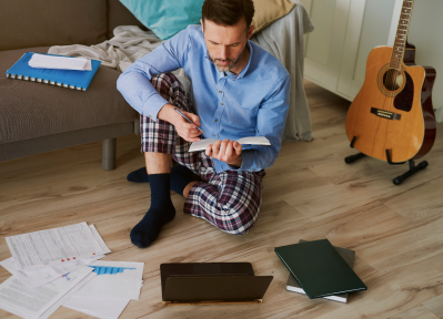high angle view man reading book while sitting hardwood floor 1